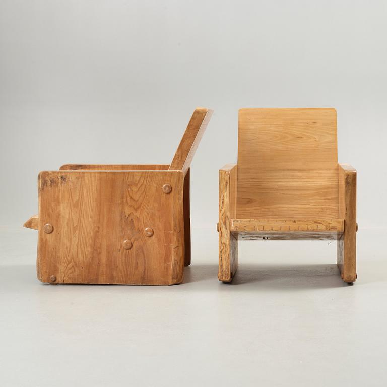 A pair of Swedish mid 20th Century armchairs, reportedly by architect Uno Liljeqvist, cabinetmaker Fritjof Nilsson.