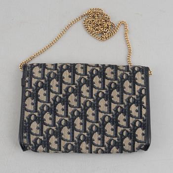 Christian Dior, a handbag/clutch.