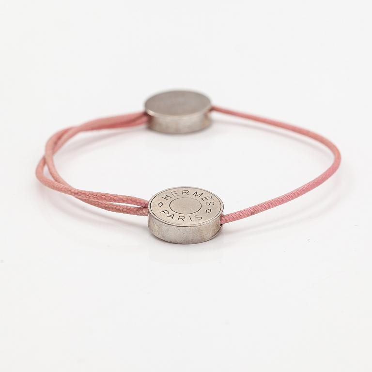 Hermès, A "Coulisse" bracelet made of metal and cord. Marked Hermès Paris.