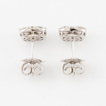 A pair of earrings in 18K white gold set with round brilliant-cut diamonds.