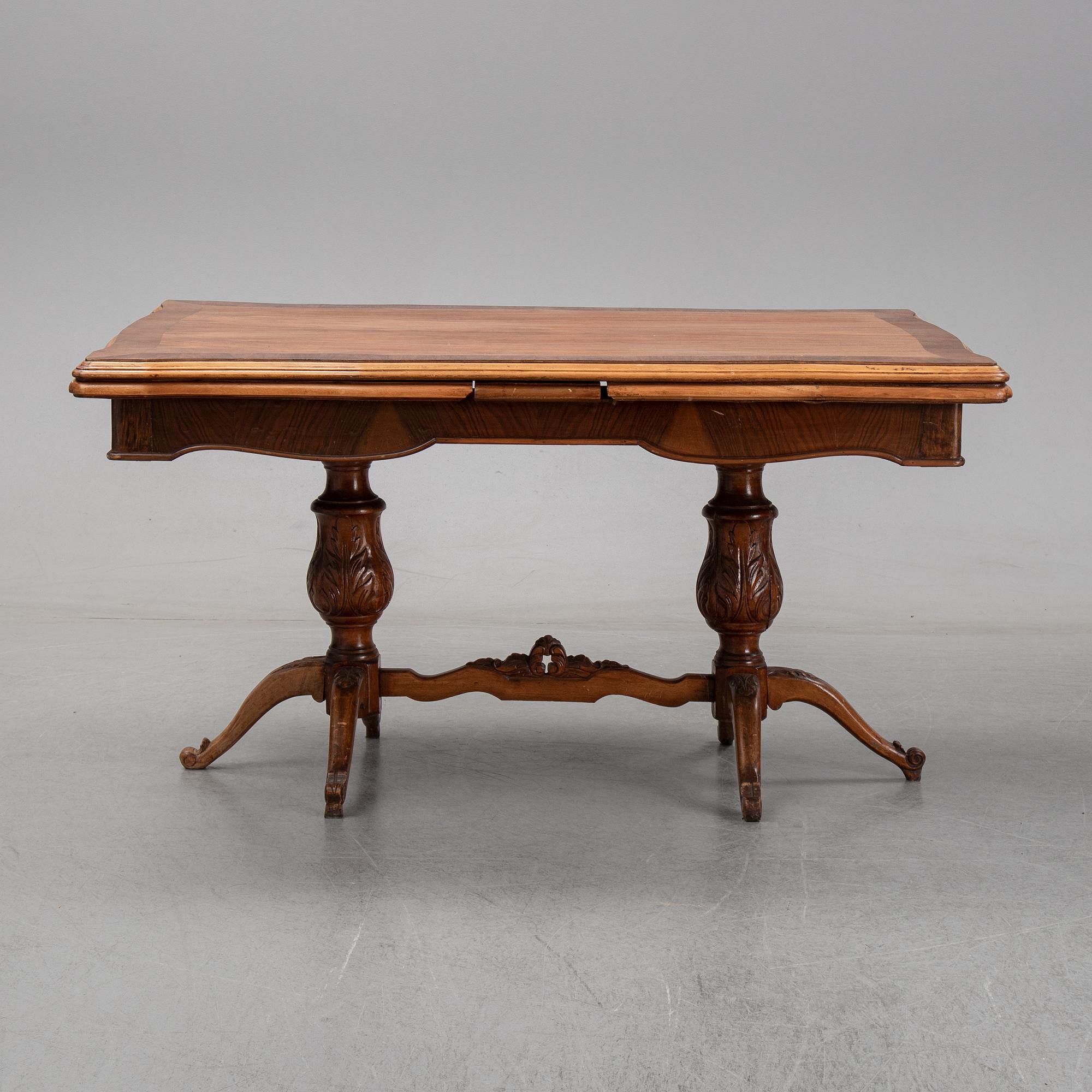 A first halg of the 20th Century walnut veneered table.