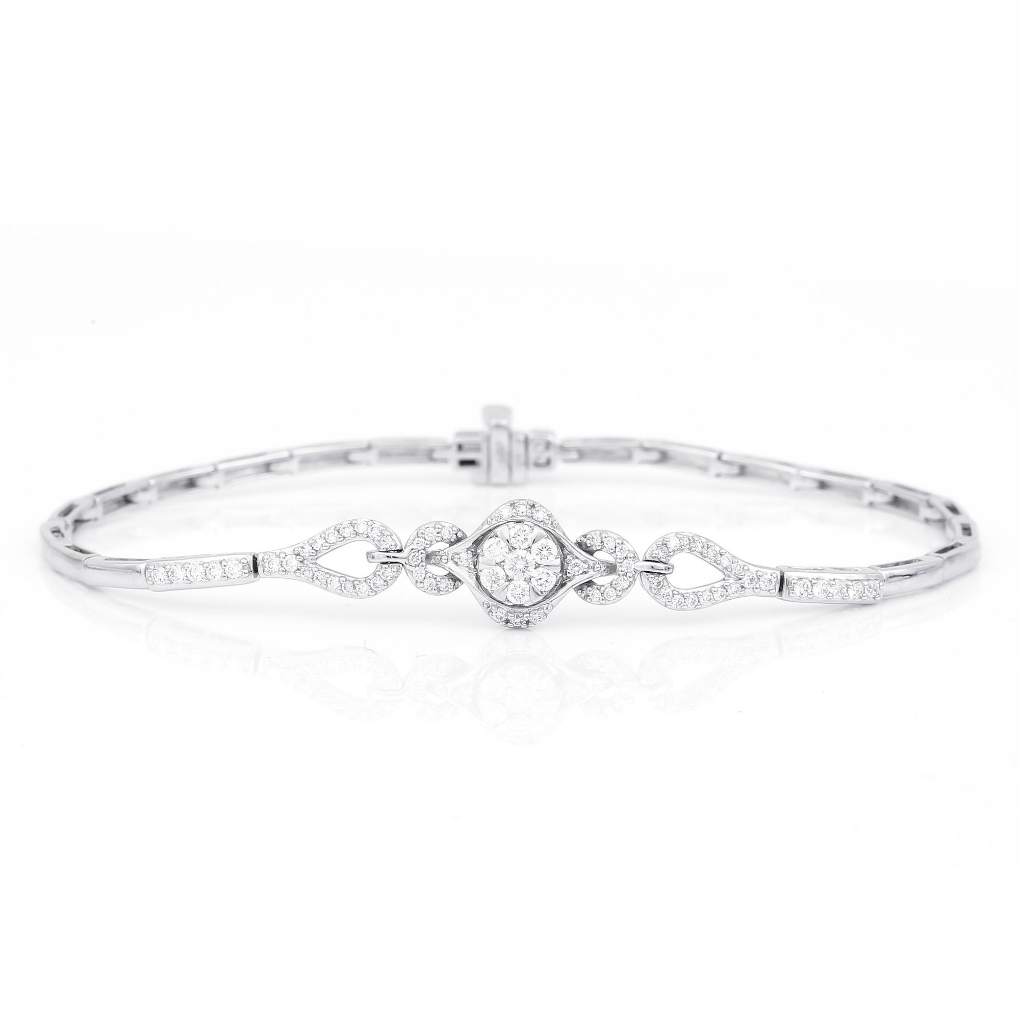 ARMBAND, 14K vitguld med runda och briljantslipade diamanter, tot ca 0,72 ct. Vikt ca 7,27 g.