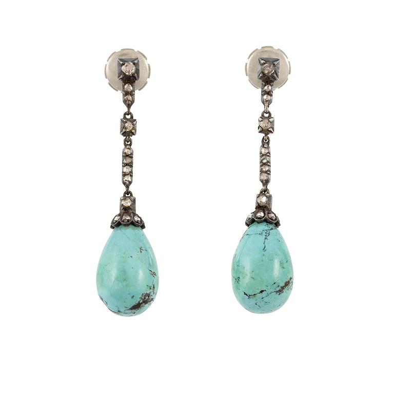 A pair of silver and 18K gold earrings with turquoise drops and rose-cut diamonds.