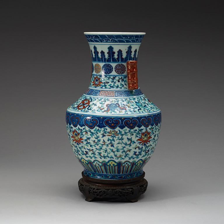 A doucai vase with bamboshaped handles, Qing dynasty, 19th Century, with Qianlong seal mark.