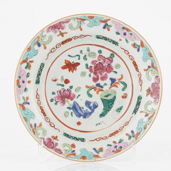 A set of four famille rose dessert dishes, and two Chinese porcelain figures, Qing dynasty, 18th / 19th Century.