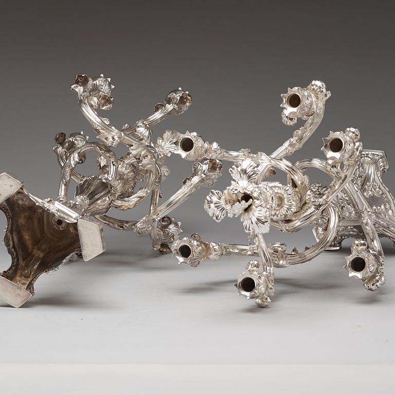 A pair of Swedish 19th century silver candelabras, marks of Gustaf Möllenborg, Stockholm 1845 and 1893.