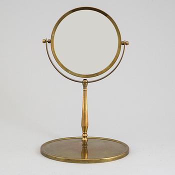 A mid 20th century brass and glass mirror.