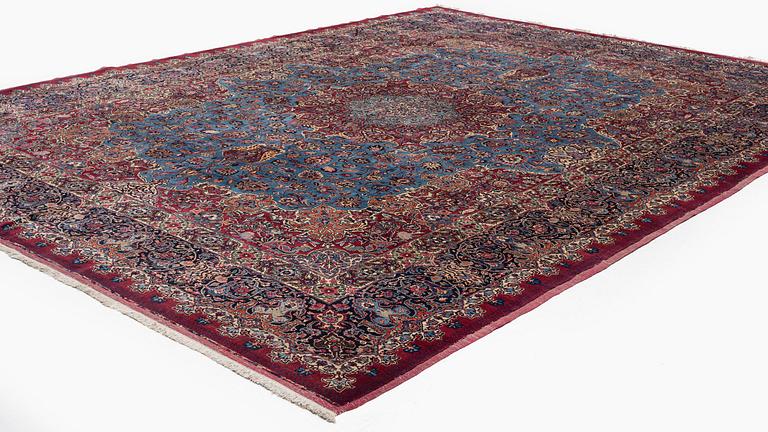 A Mashad carpet, signed Saber, c. 468 x 348 cm.