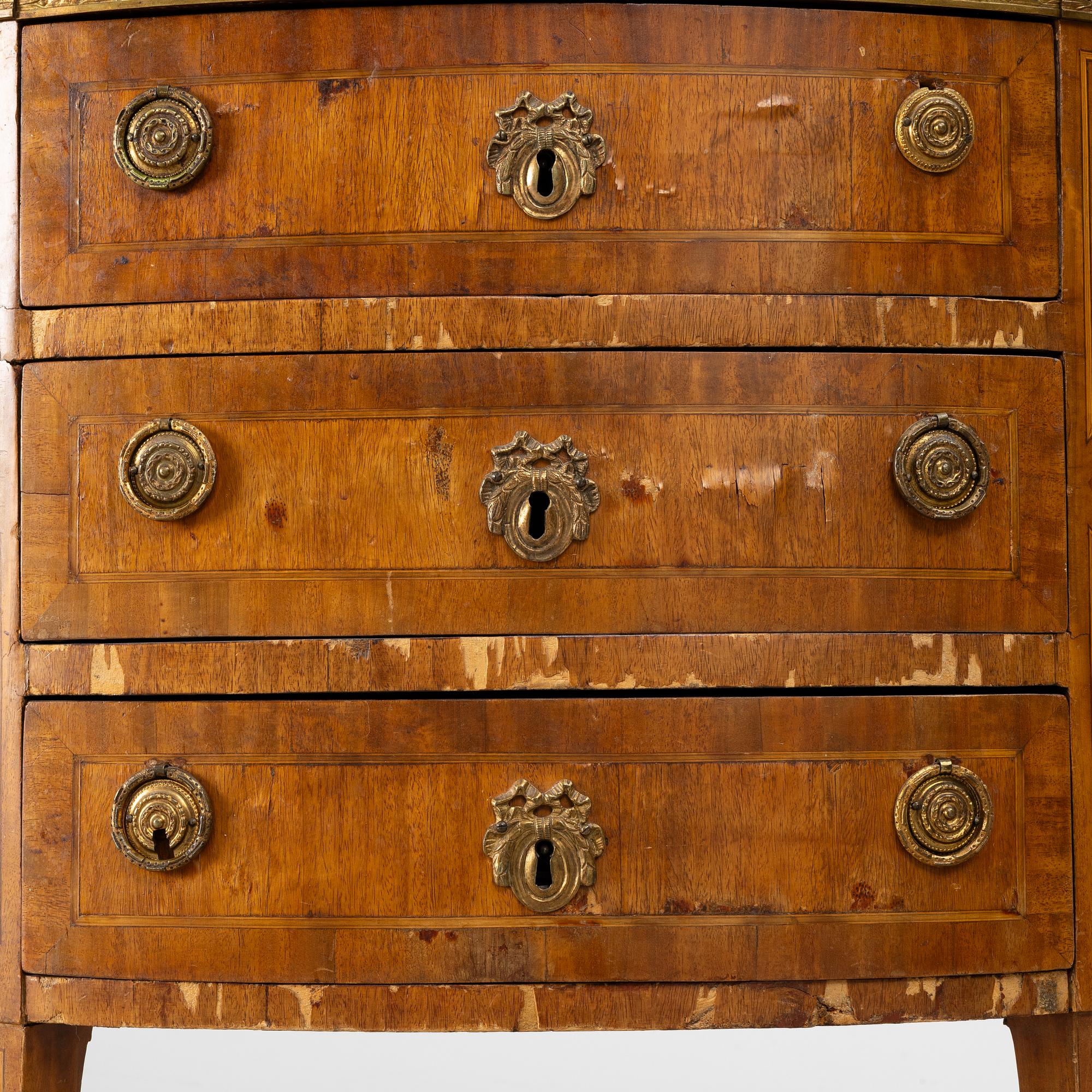 A Louis XVI style chest of drawers, 19th century.