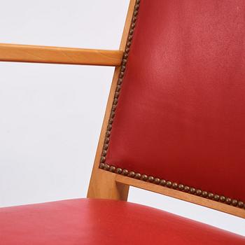 Josef Frank, a pair of walnut and red leather easy chairs, Svenskt Tenn, Sweden 1940-60s.