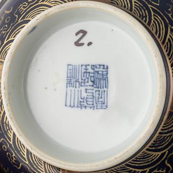 A Chinese bowl decorated with five clawed dragons, Qing dynasty with Qianlong mark.