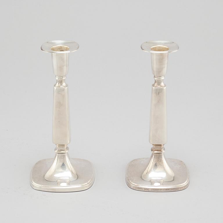 A pair of silver candlesticjs by Tore Eldh for K&EC in Gotheburg, 1970.