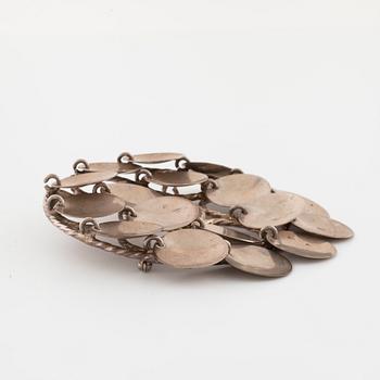 FRANK JUHLS, Kautokeino, Norway, a brooch.