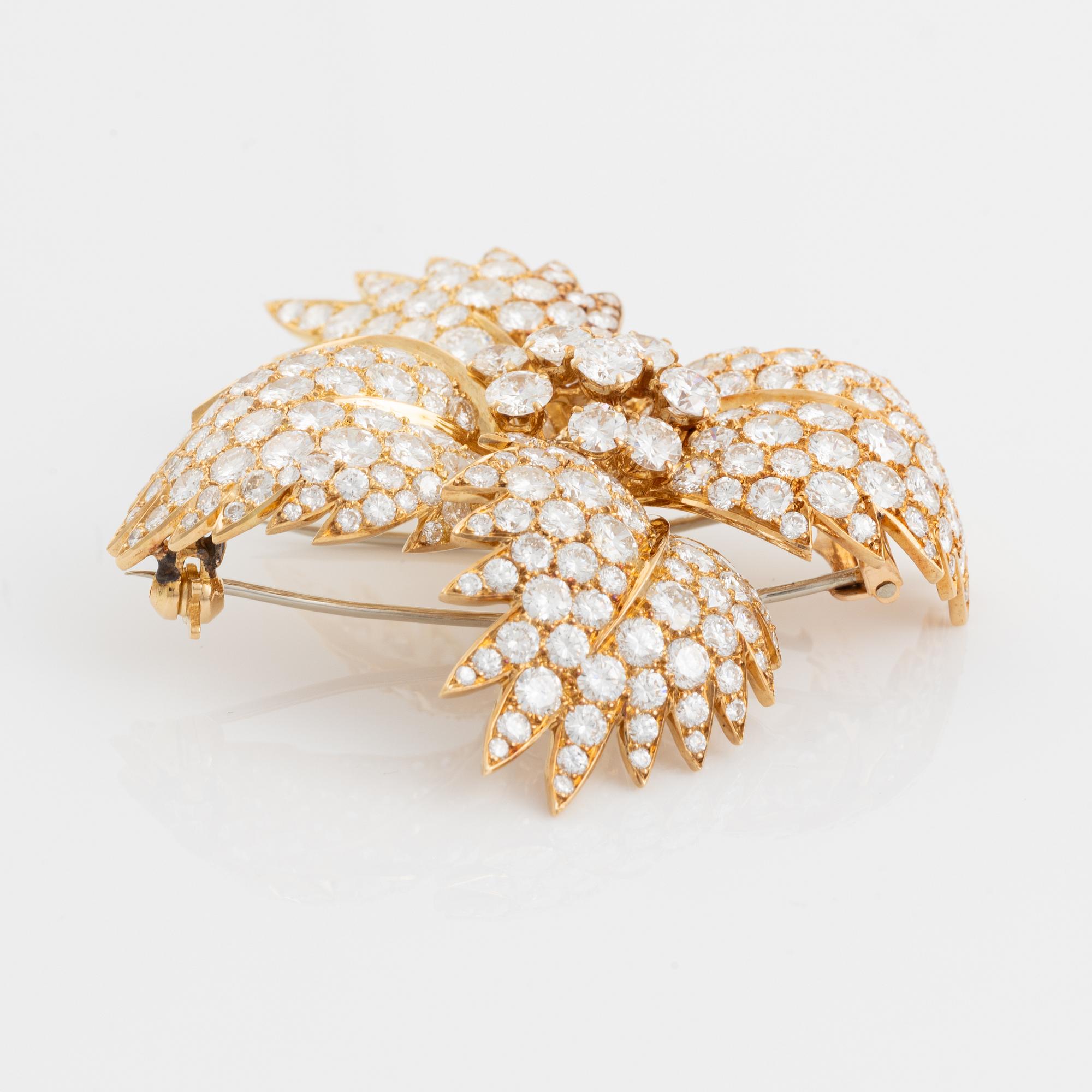 Van Cleef & Arpels brosch 18K guld med runda brilljantslipade diamanter.