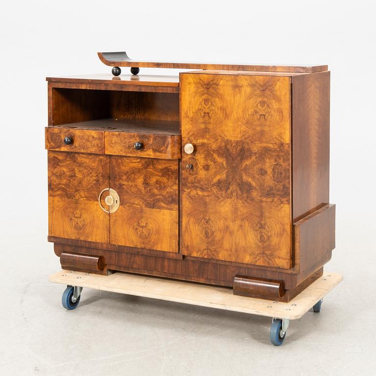 A walnut veneered Art Déco cabinet.