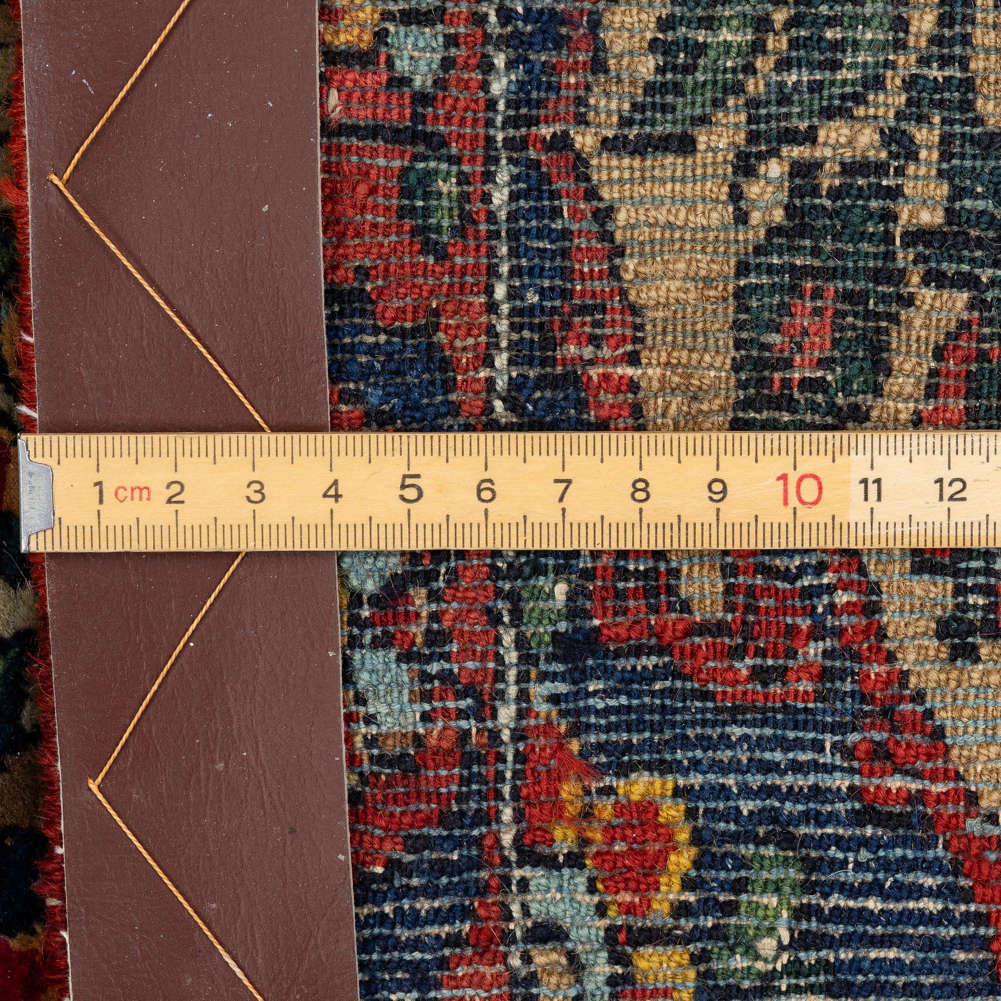 A figural oriental rug, c.. 230 x 130 cm.