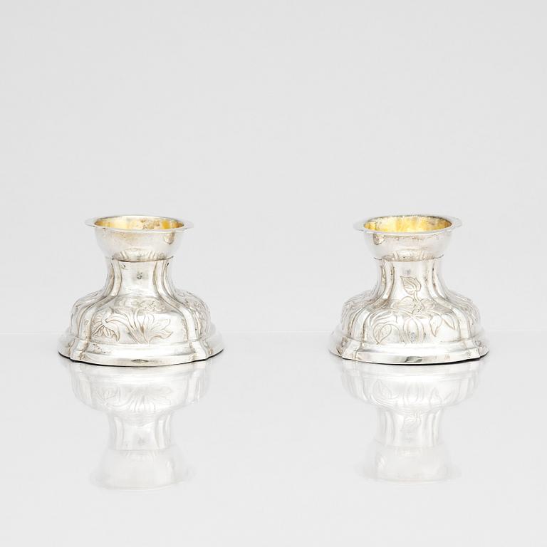 A pair of German rococo parcel-gilt silver salt-cellars, 18th century.