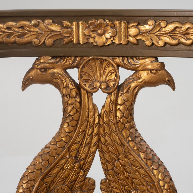 A pair of chairs and a side table, second half of the 20th century. Empire style.