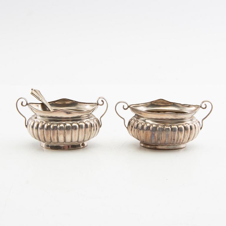A pair of salt cellars and a spoon, silver, Minshull & Latimer, Birmingham, 1899.