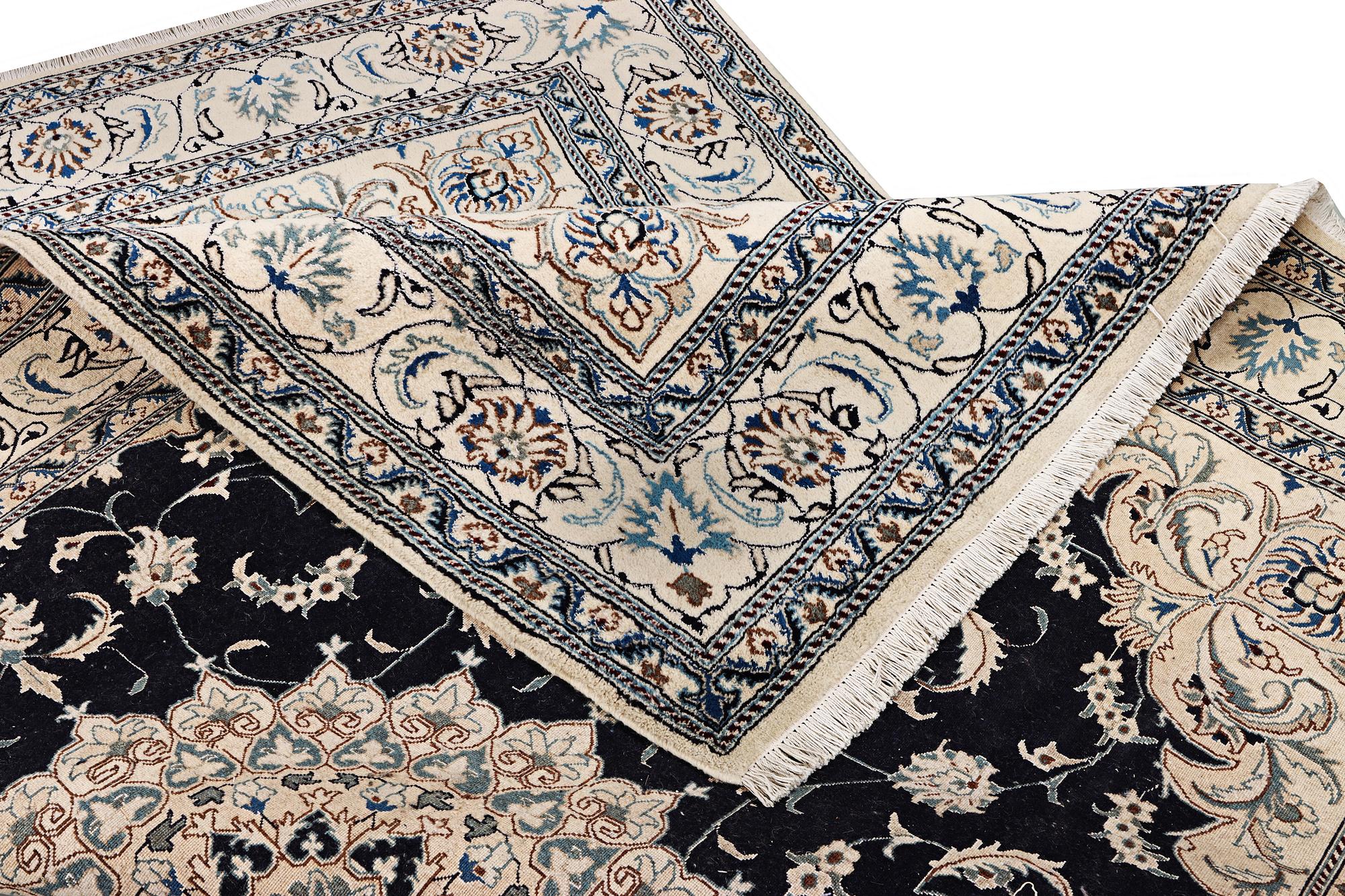 A Nain carpet, part silk, c. 303 x 200 cm.