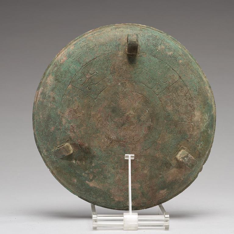 A bronze tripod food vessel and cover, "Ding", Eastern Zhou Dynasty.