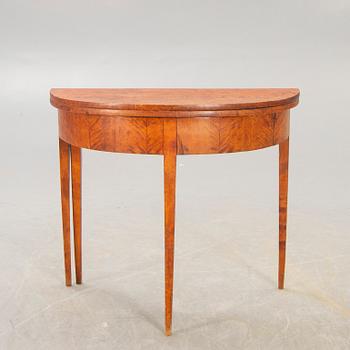 A birch late 19th century game table.