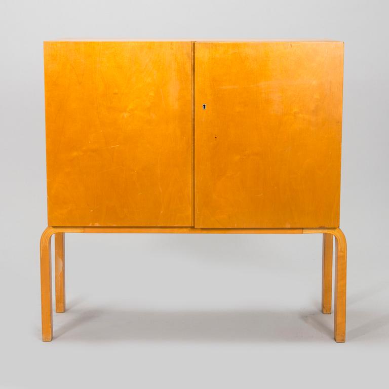 Alvar Aalto, mid-20th century '810' cabinet and a 
'69'chair Oy Huonekalu- ja Rakennustyötehdas Ab.