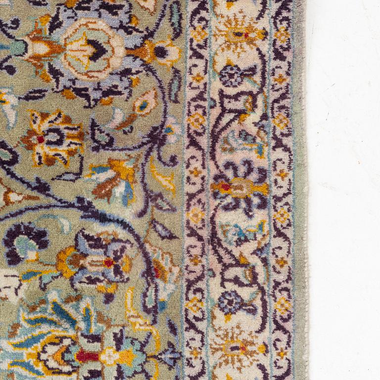 A Keshan carpet, signed, c. 410 x 297 cm.