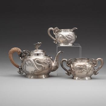 A Chinese three piece silver tea set, early 20th Century.