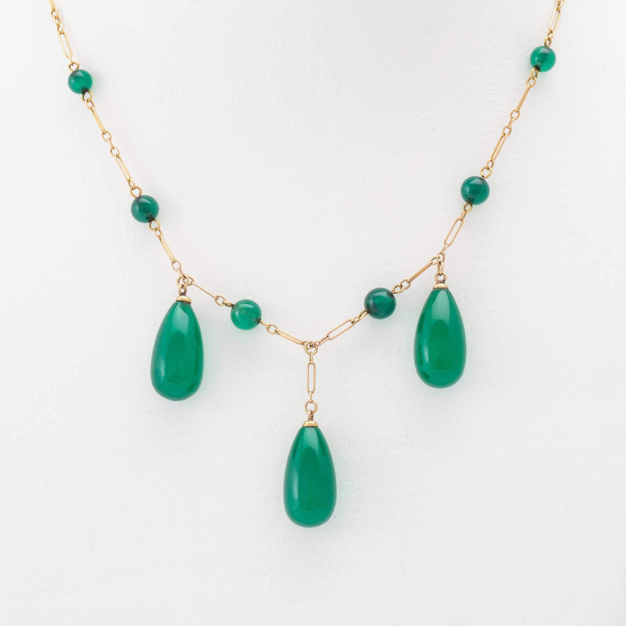 Halsband 18K guld med droppslipade agater.