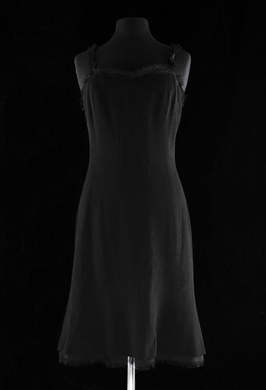 A black cocktail dress by Chanel, spring 2004.