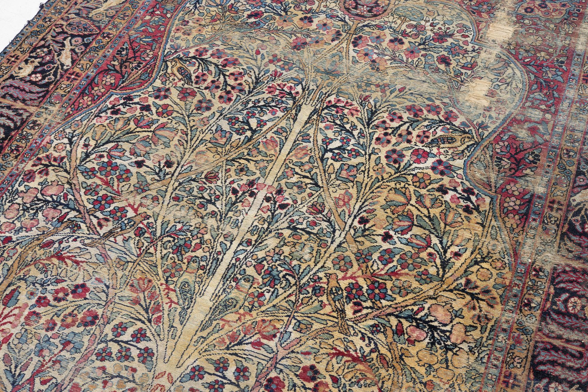 A semi-antique Kerman carpet, c. 325 x 203 cm.