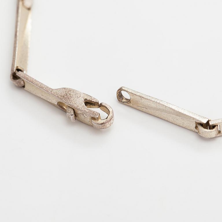 Lapponia, A necklace, bracelet and a pair of earrings made of sterling silver.