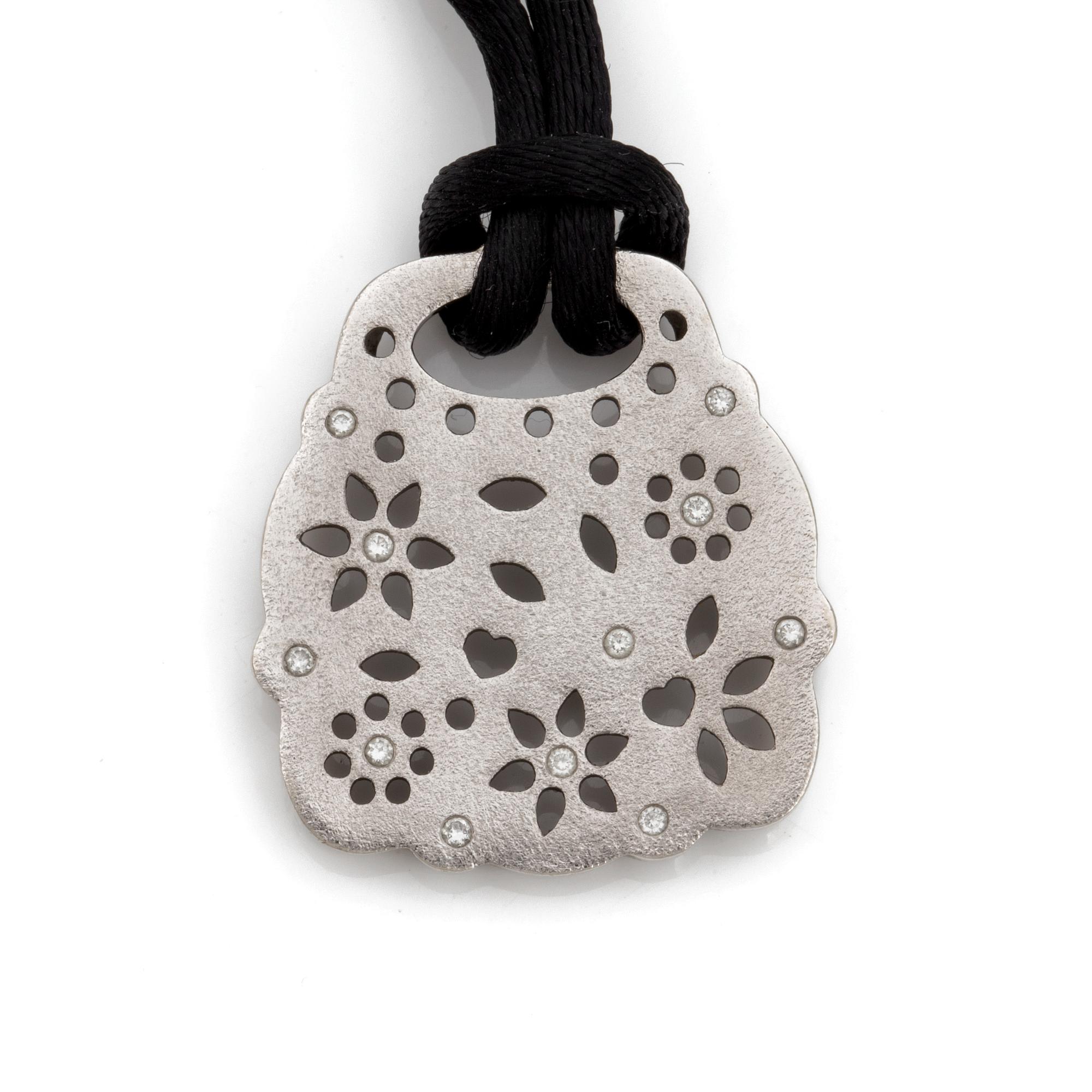 A Charlotte Lyngaard for Ole Lynggaard "Lace" pendant with brilliant cut diamonds total circa 0.11 ct.