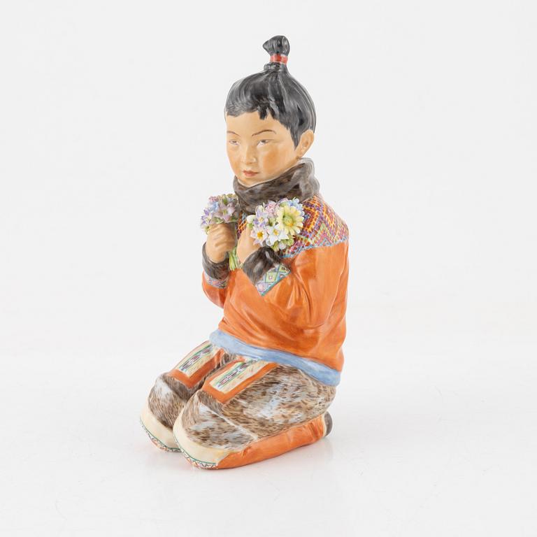 A Royal Copenhagen porcelain figure of an innuit from Grönland, Denmark, early 20th Century.