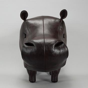 A leather footstool by Dimitri Omersa & Co.