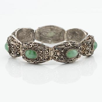A Chinese silver and green stone bracelet and a pair of earrings, early 20th century.