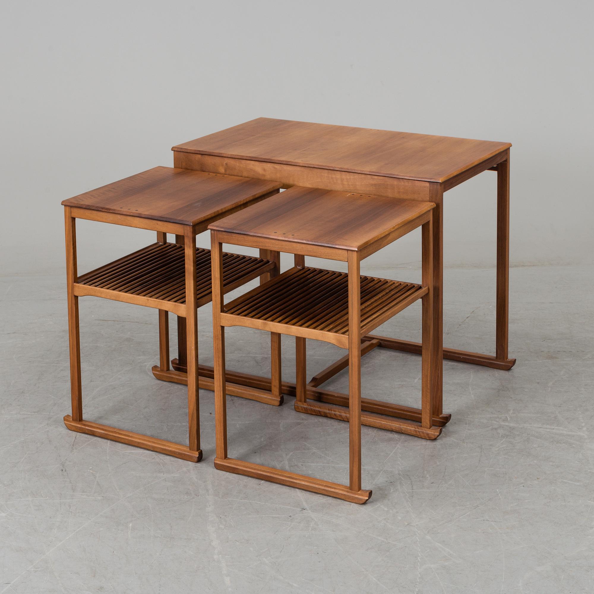 CARL MALMSTEN, a 'Släden' nest of three mahogany tables.