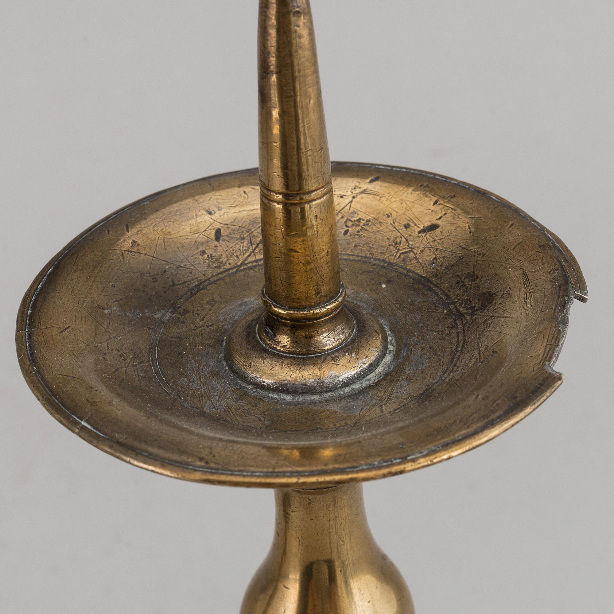 A pair of 17th century bronze candlesticks.