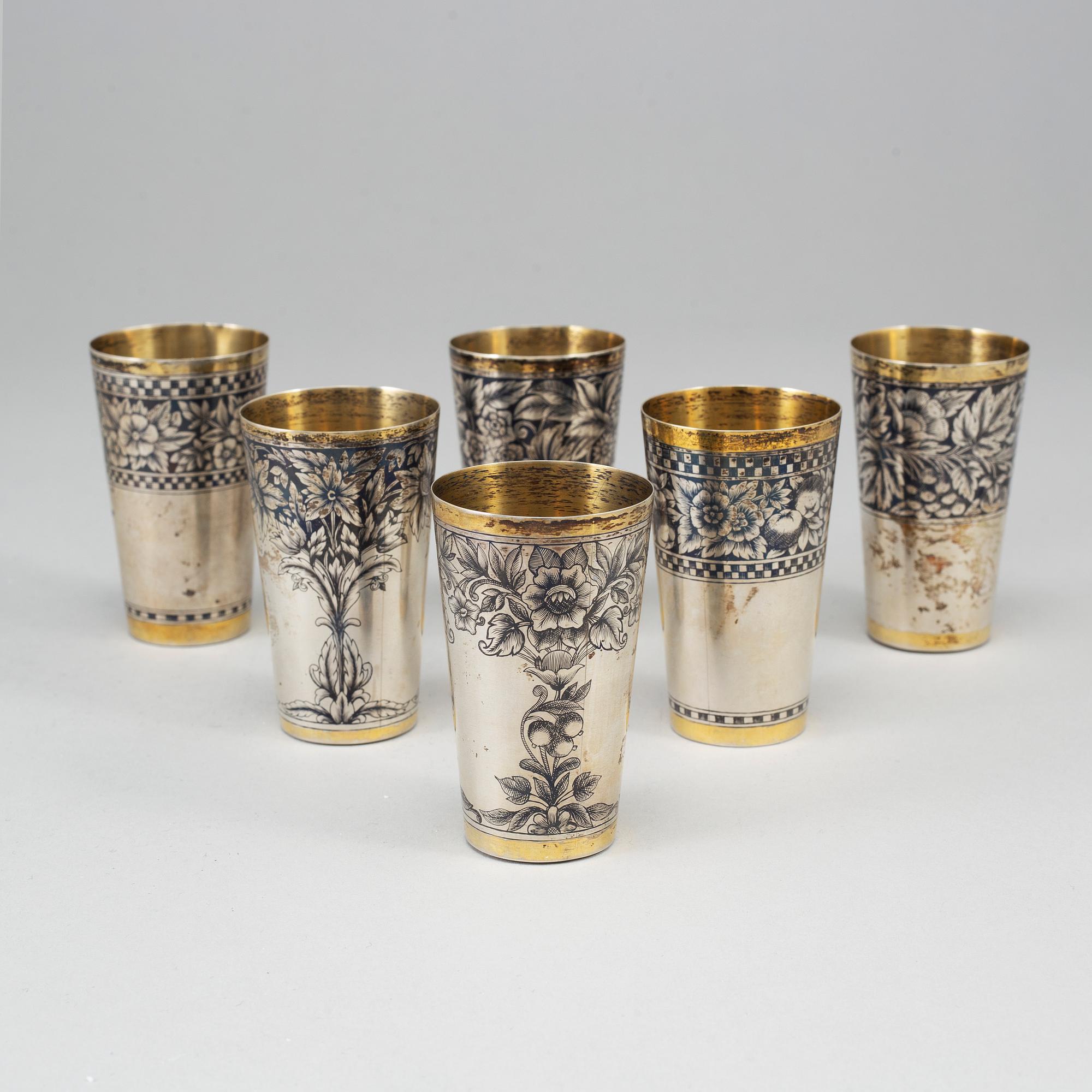 A Russian set of 6 parcel-gilt silver and niello vodka-cups, the Soviet Union/Russia, second half of the 20th century.