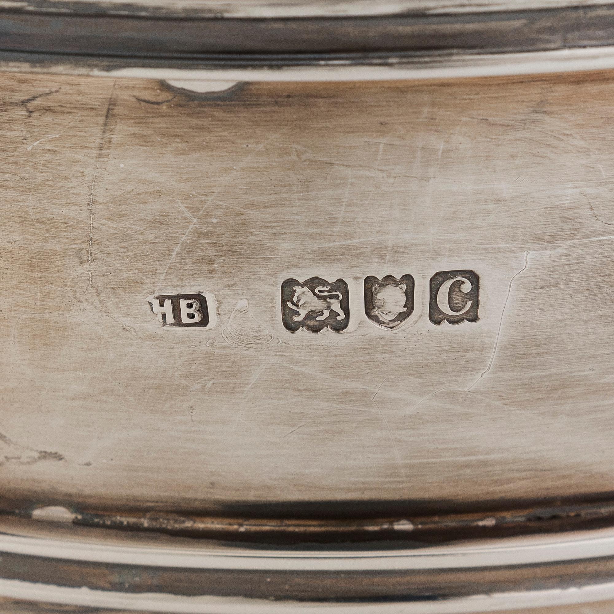 A set of two bowls with handles, sterling silver, England.