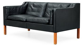 472. A Børge Mogensen black leather two seated sofa, Fredericia, Denmark.