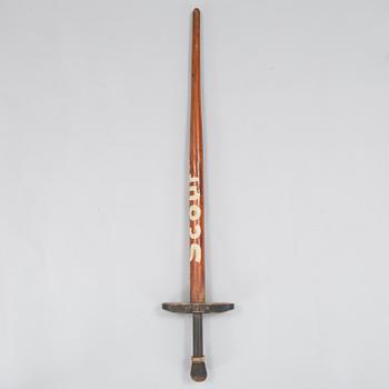 A 20th century wood pogo stick.