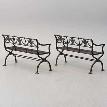GARDEN SOFAS, a pair, cast iron, empire style, late 19th century.