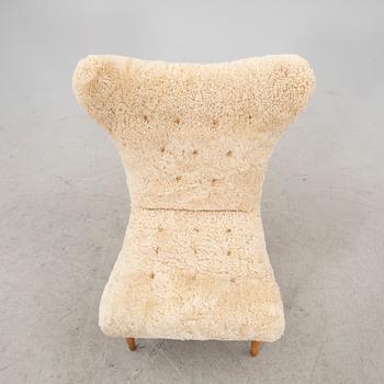 A Swedish Modern 1940s sheep skin armchair.