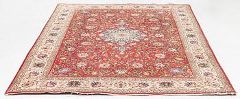 A carpet, Tabriz old, signed, approximately 294 x 208 cm.