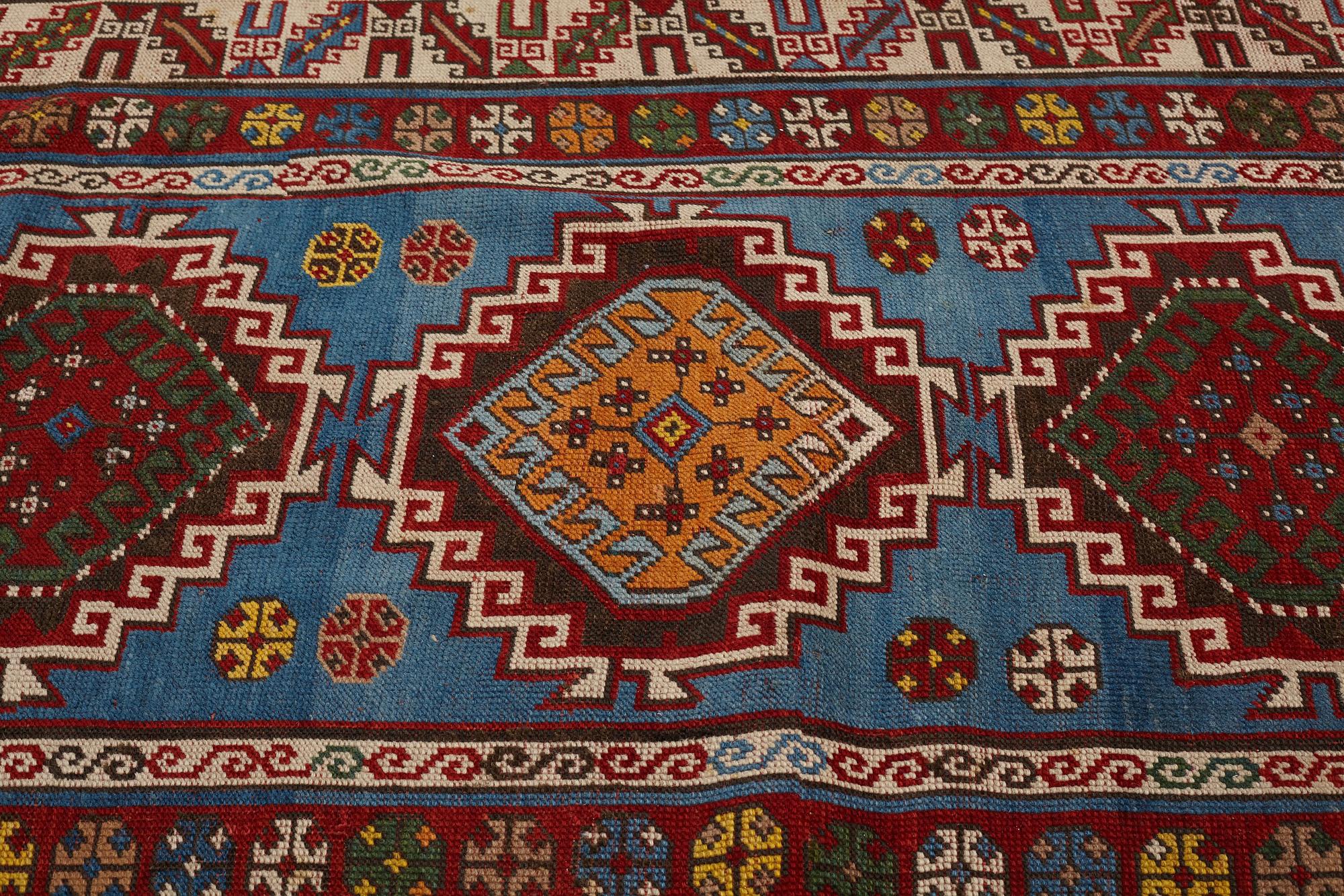 A RUG, a semi-antique Gendje probably, ca 209 x 124 cm.