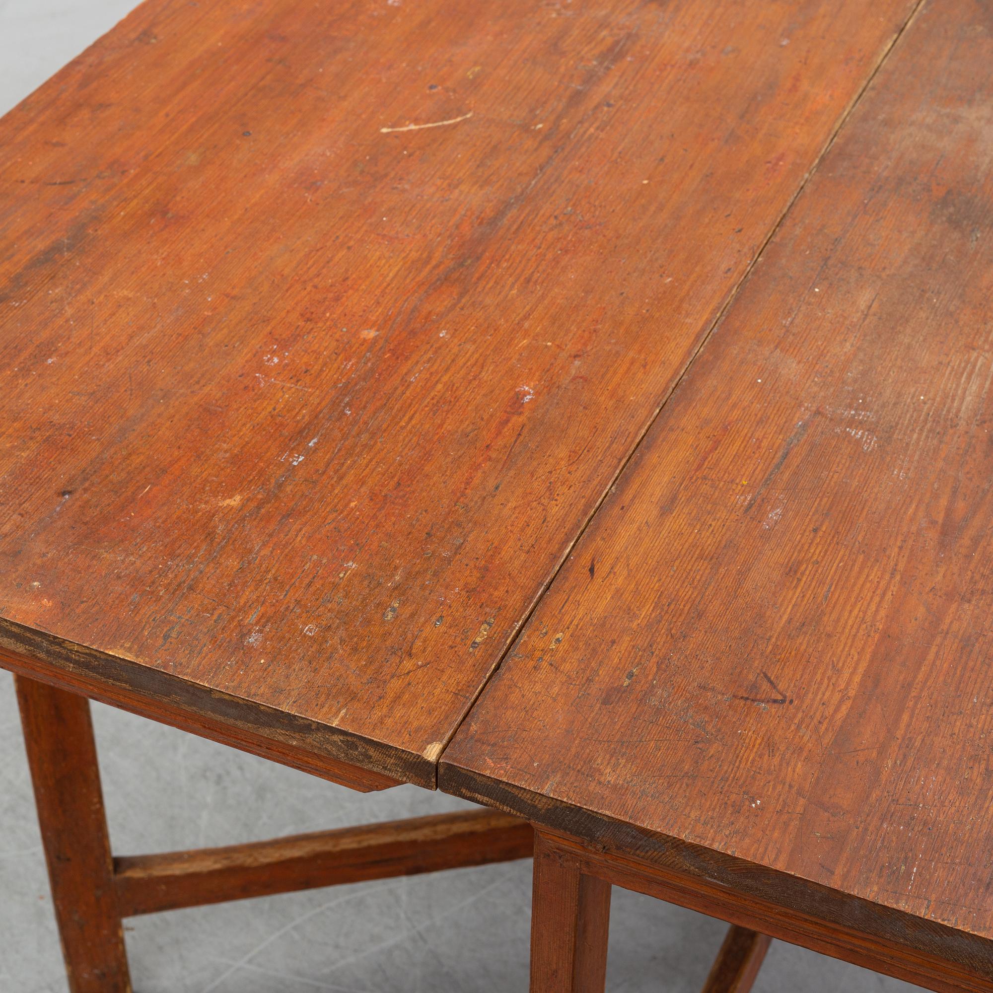 A pine gate leg table, 19th Century.