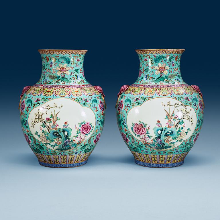 A large pair of turquoise ground famille rose vases, early 20th Century with Qianlongs sealmark.