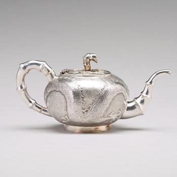 A Chinese four piece silver tea set, Luen Wo, Shanghai, 1875-1925.